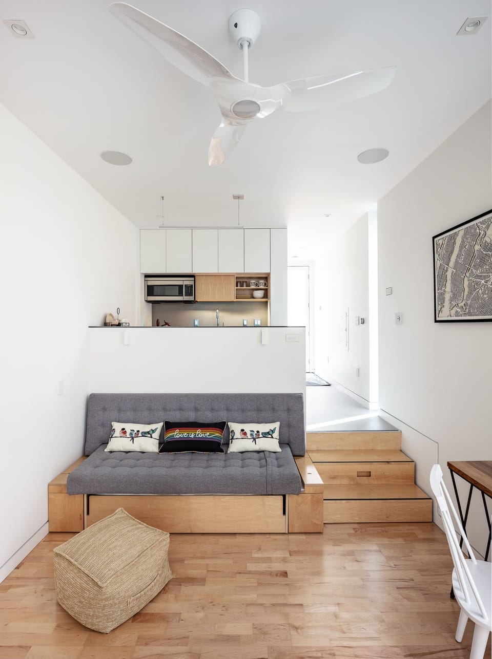 The Queen bed can be tucked away and converted into a seating area.