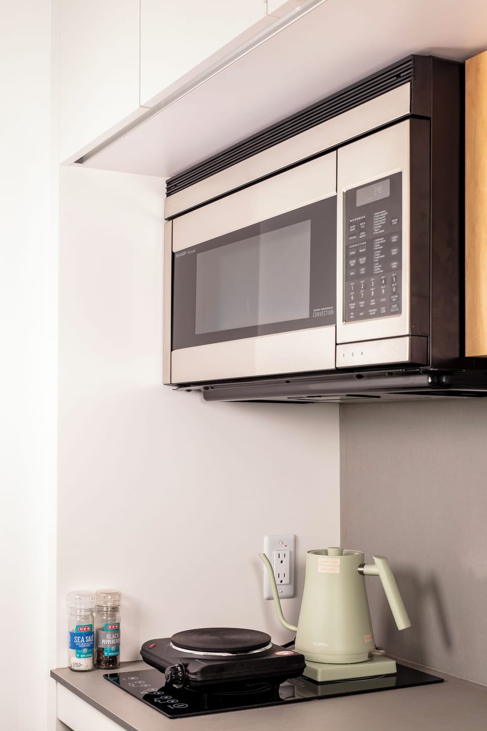 Kitchenette features a microwave, hot plate, Mr. Coffee pot & hot water kettle