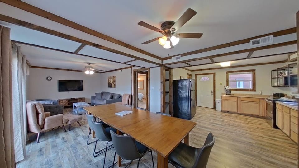 A welcoming retreat with plush seating and a generous dining table, perfect for relaxing and making lasting memories