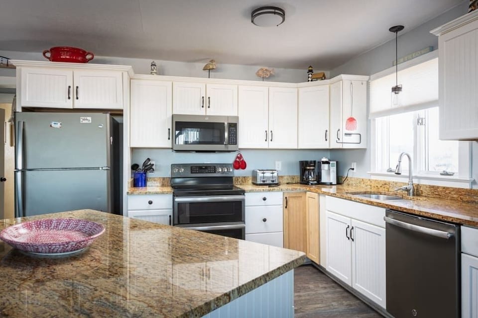 Top Level: Fully Stocked Kitchen with Island and Bar Seating