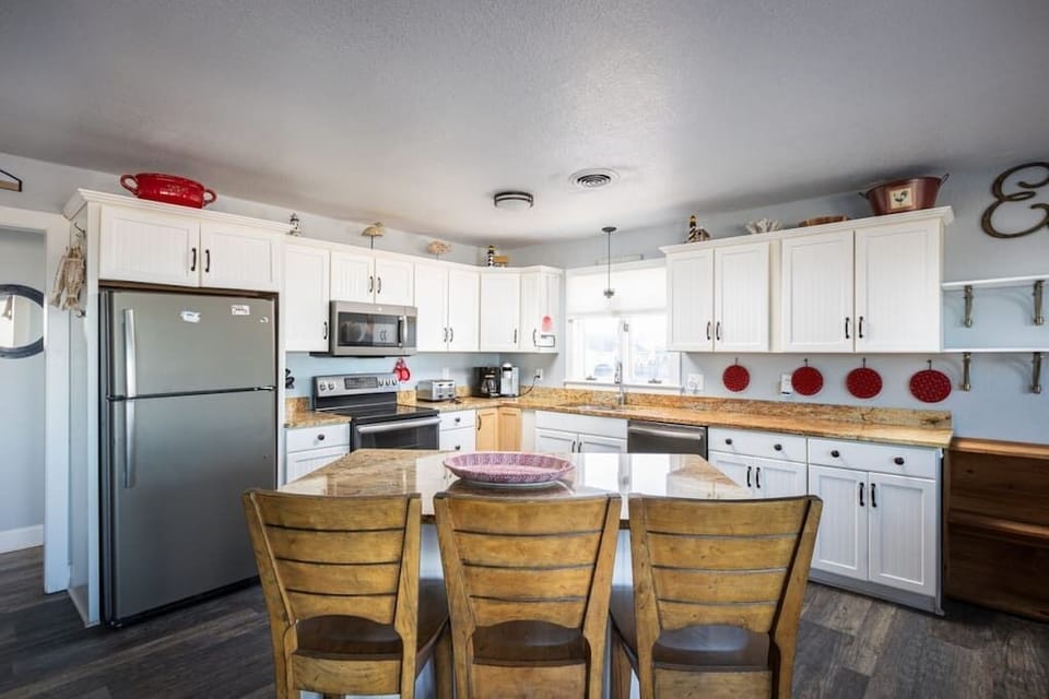 Top Level: Fully Stocked Kitchen with Island and Bar Seating