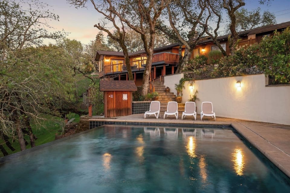 Large saltwater infinity pool. Gas-heated to be comfortable all year. 8 pool loungers and a giant bin of pool noodles are provided on the pool deck.