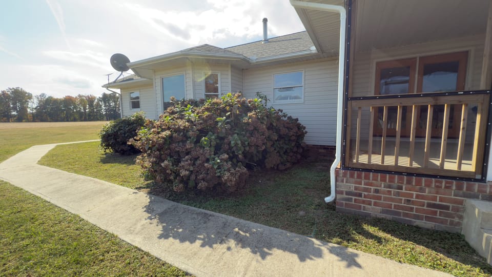 Back of the house and screen porch. 