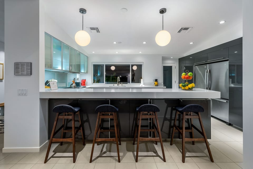 Chef's kitchen includes counter seats, ice maker& 200+ bottle wine refrigerator 
