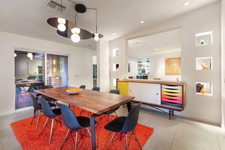 Dining room w/ Ligne Roset "Odessa" table/Pablo lights/Finn Juhl 1955 Credenza