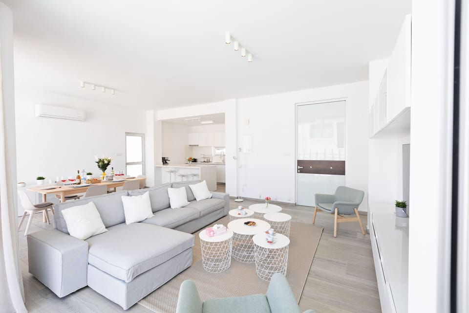 Living room with comfortable corner sofa and Smart TV