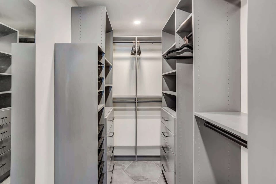 Walk-in closet in primary bedroom.