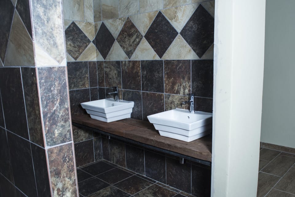 Separate tub and shower, rainfall showerhead, free toiletries, bathrobes