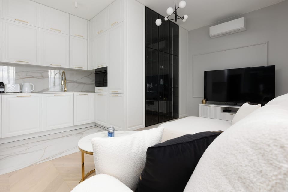 Another perspective of the kitchen, showcasing its spacious layout and high-end finishes.


