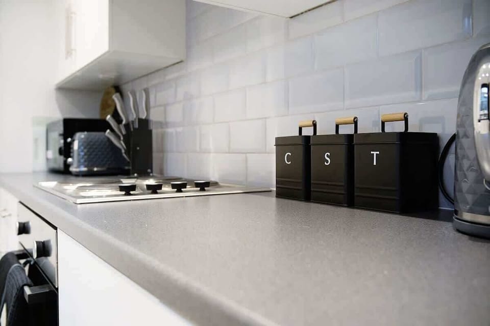 Family-friendly kitchen oasis equipped with all essentials, including a washer & dryer, oven, fridge and full cookware set. 