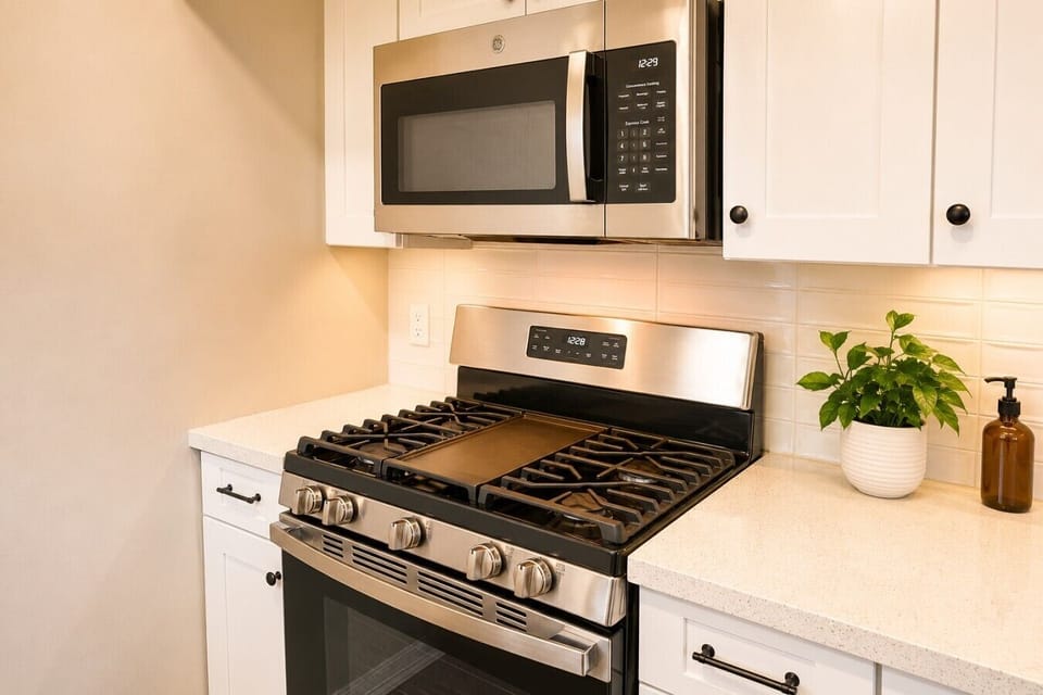 Gas range and built-in microwave make cooking simple and convenient.