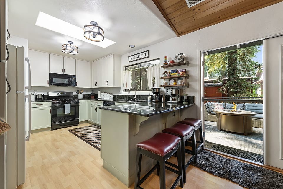 We'll be in the kitchen! Or perched on a stool looking into the kitchen.