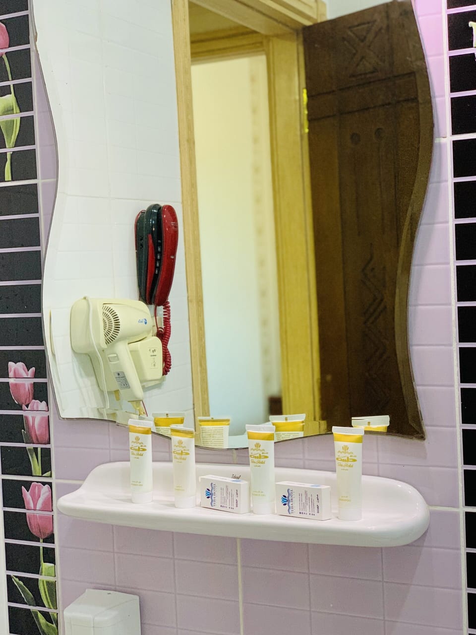 Shower, designer toiletries, hair dryer, slippers