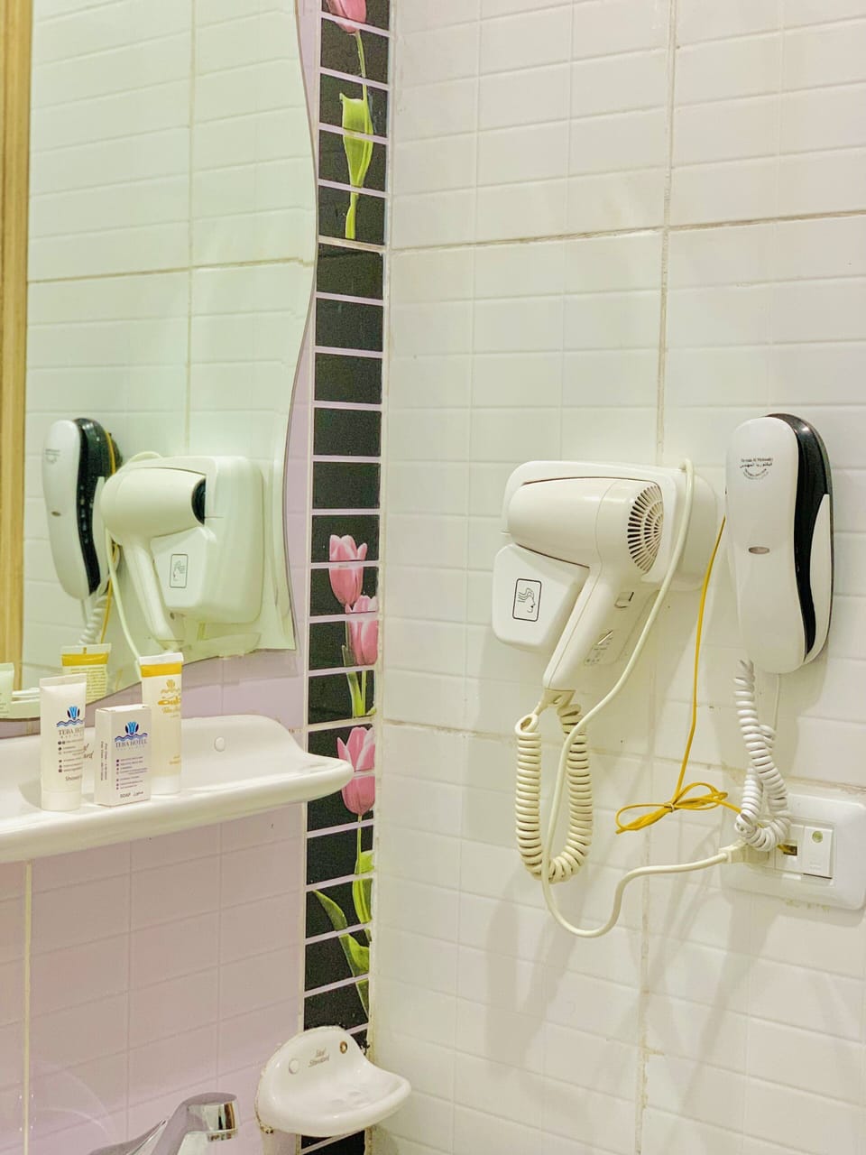 Shower, designer toiletries, hair dryer, slippers