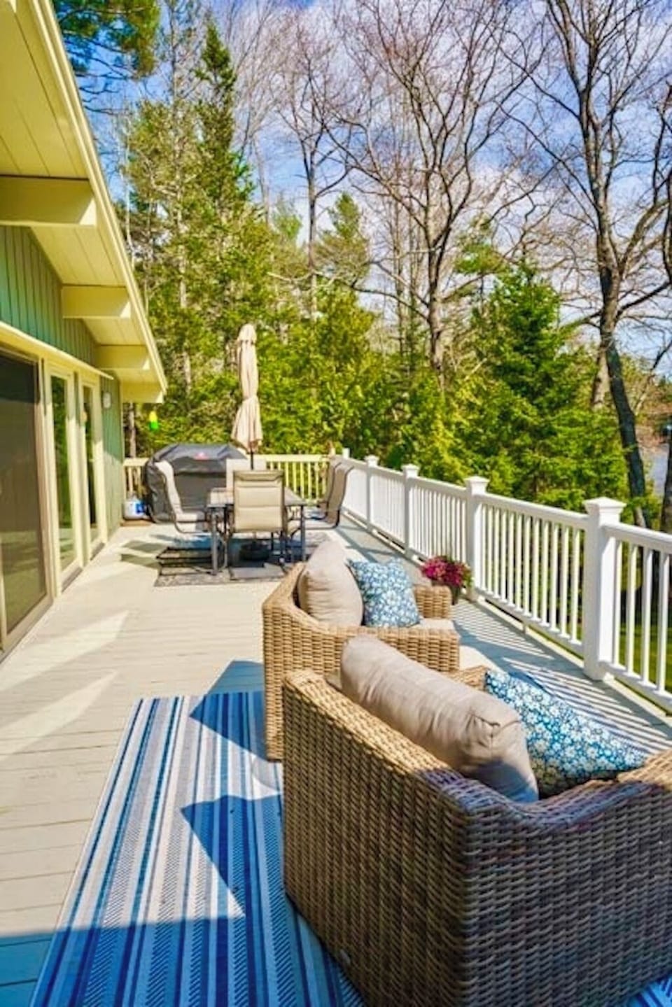 Large outdoor deck with dining and comfy furniture