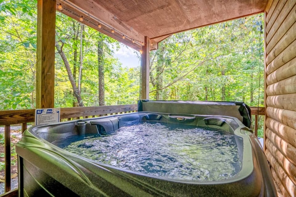 Soak in the new hot tub under the string lights