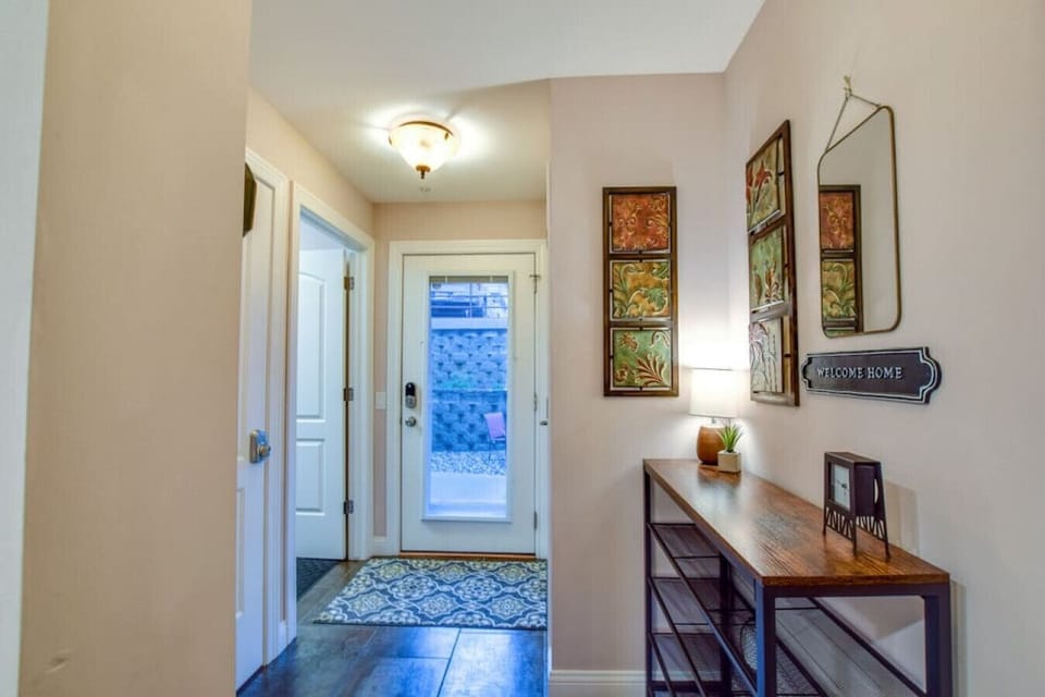 Spacious entryway with room to stow your shoes and odds and ends; separate laundry room on the left.