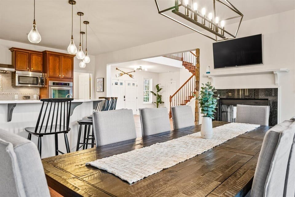 The spacious dining table accommodates up to 8 people