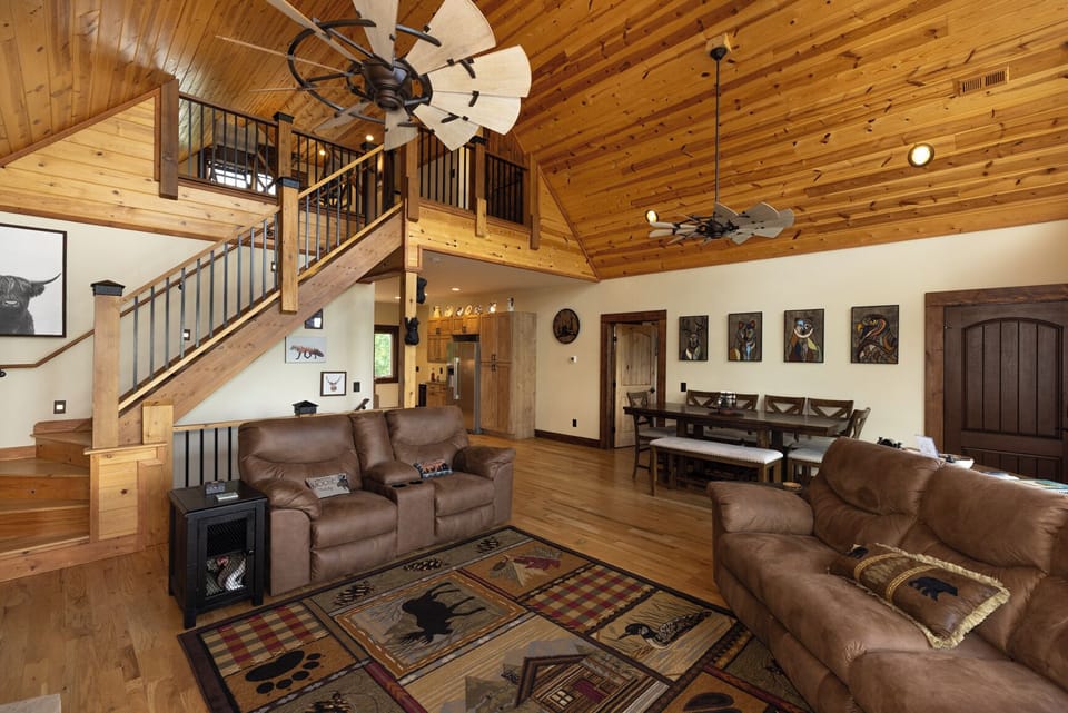 The living room also leads up to the loft bedroom area.
