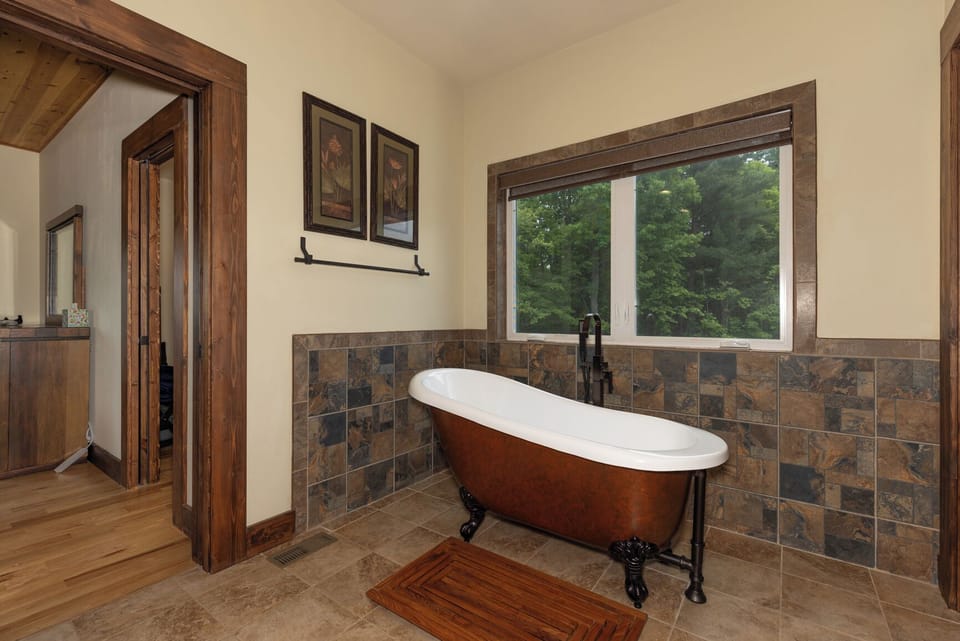 Even the main bath soaking tub has views of woods and occasionally the deer.