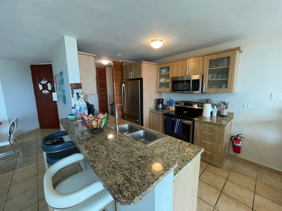 Apartment, 3 Bedrooms, Ocean View | Private kitchen | Full-size fridge, microwave, oven, stovetop