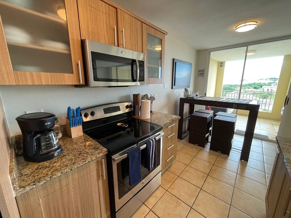 Apartment, 3 Bedrooms, Ocean View | Private kitchen | Full-size fridge, microwave, oven, stovetop
