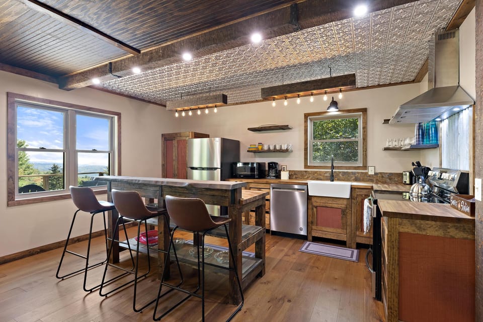 Gorgeous kitchen, handmade cabinets, and well-stocked for the cooks out there.