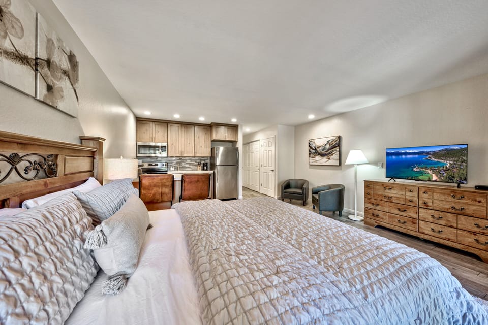Your stylish studio features a plush king bed, fully equipped kitchen, and cozy seating area where you'll unwind after mountain adventures.