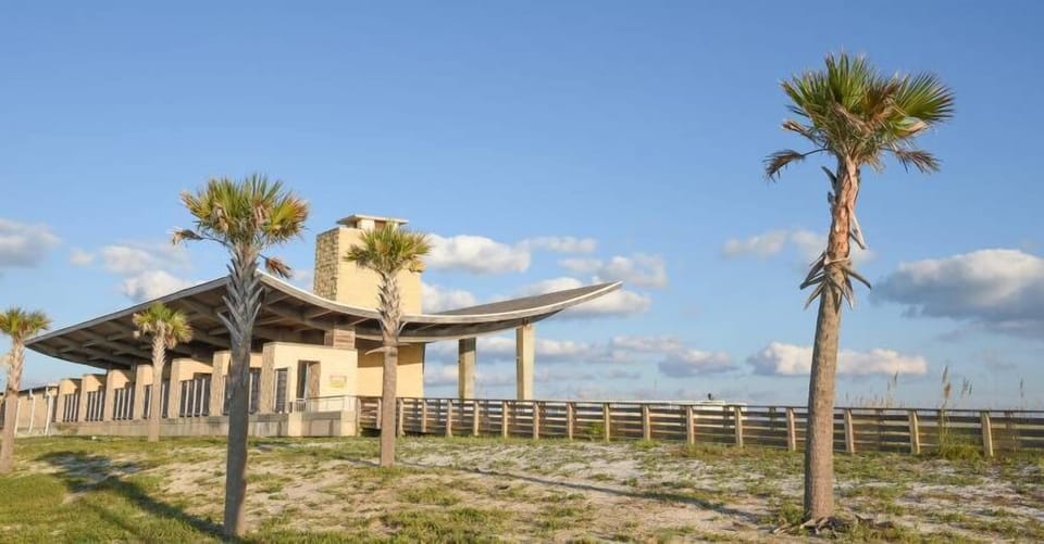 Beachfront Pavilion: Sleek architecture meets palm-fringed views—perfect for island relaxation!