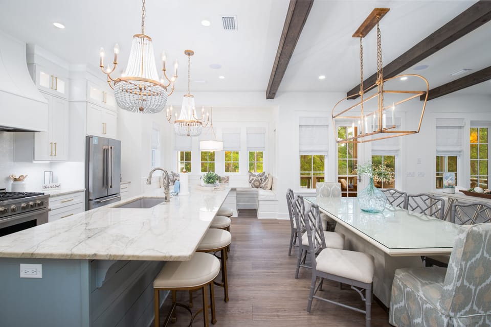 Elegant kitchen with marble counters, crystal chandeliers, and breakfast bar where you'll create culinary memories in sophisticated style.