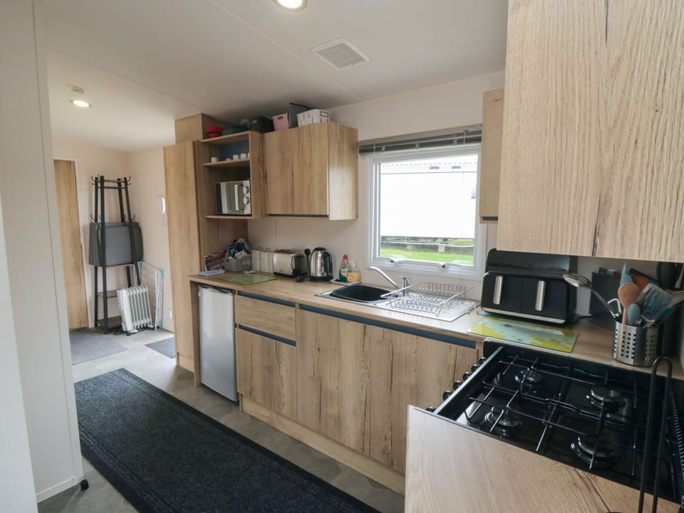 Fridge, electric kettle, toaster, cookware/dishes/utensils