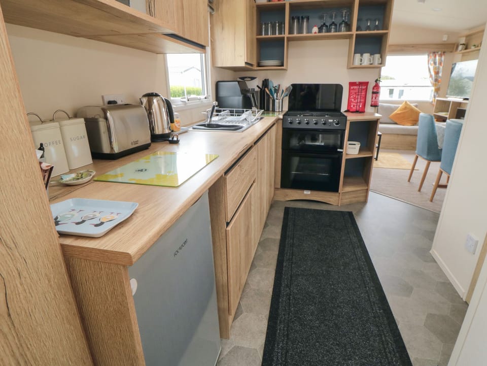 Fridge, electric kettle, toaster, cookware/dishes/utensils