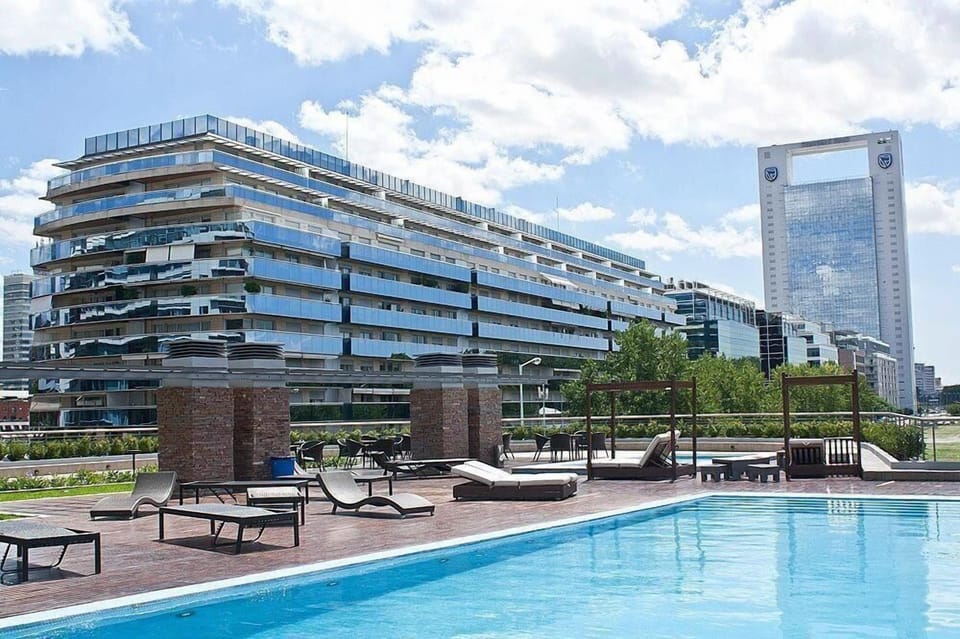 Seasonal outdoor pool, pool umbrellas, lifeguards on site