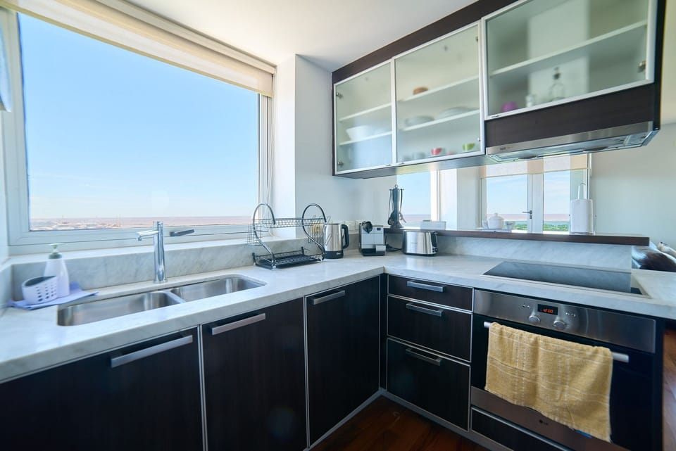 Full-size fridge, microwave, cookware/dishes/utensils