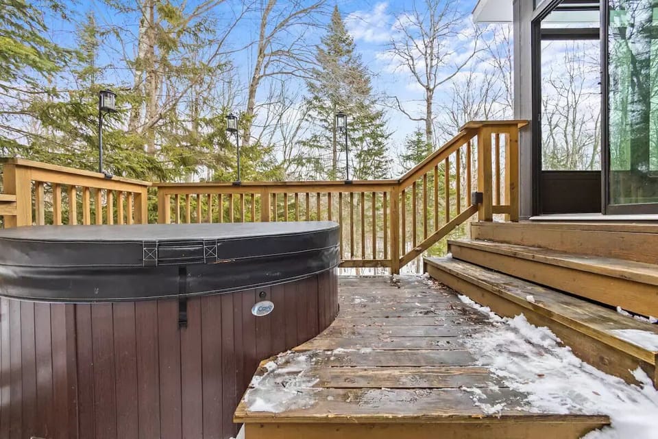 Relax by the hot tub after a fun day of adventures. Hot tub fits 5. 