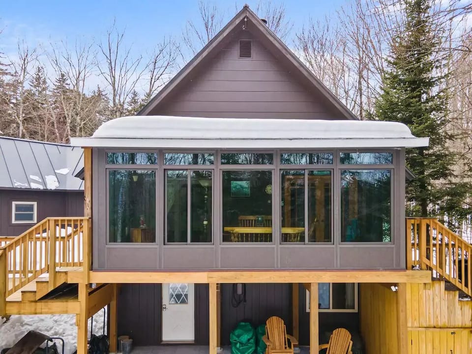 Dining room with hot tub on one side and patio on other. 