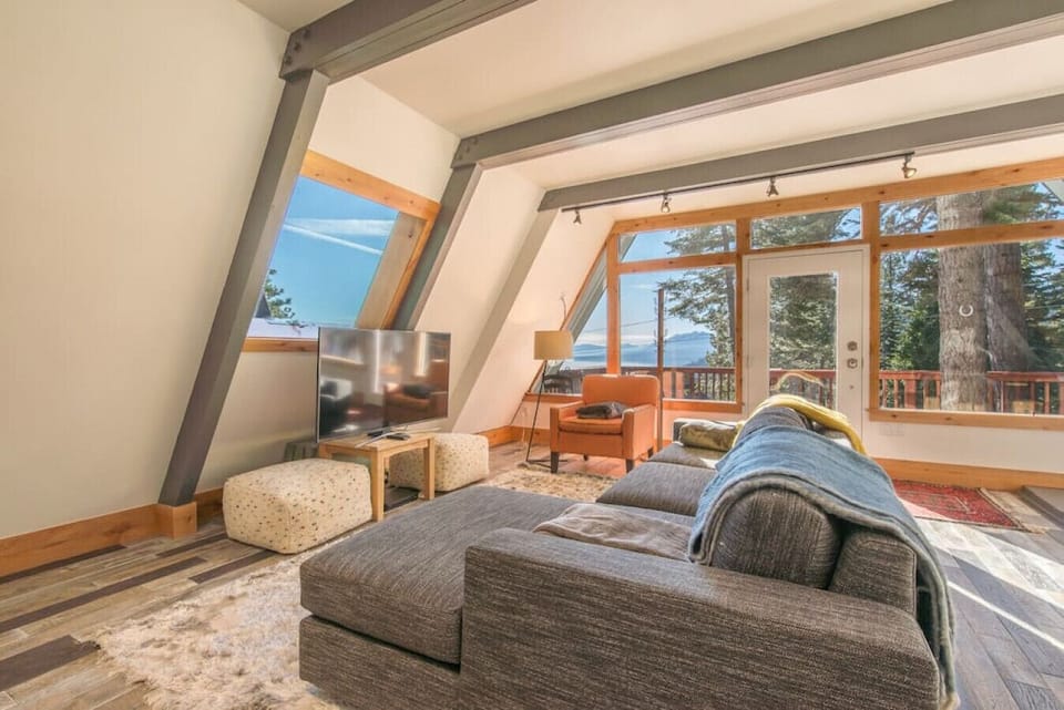 Open concept living / dining / kitchen with views of Lake Tahoe