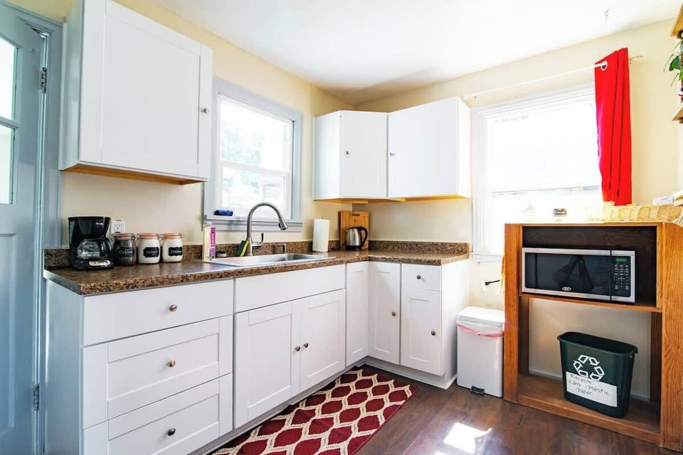 Sink, microwave. Kitchen door leads to laundry room. 