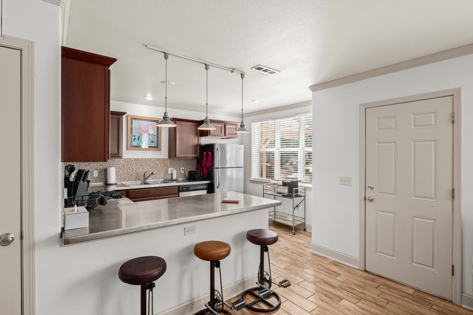 Stocked kitchen with comfortable countertop seating