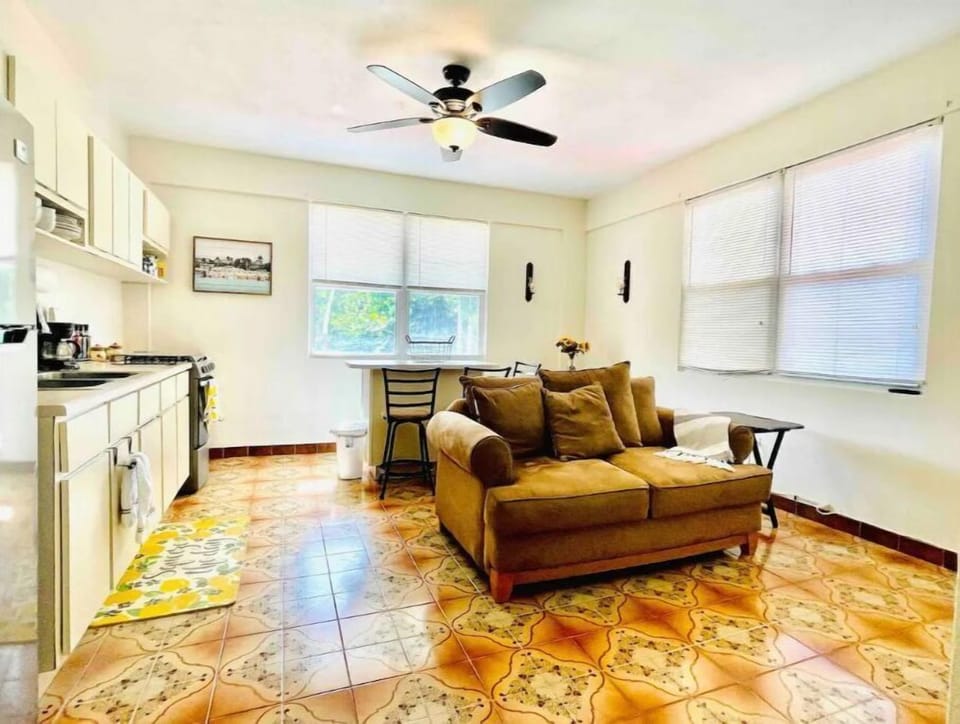 Unit B: open area with kitchen, TV, sitting and dining area.