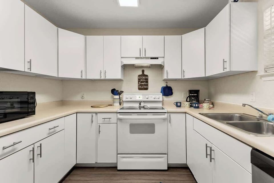 Cook with ease in a clean, bright kitchen fully stocked for family meals after a day of adventure