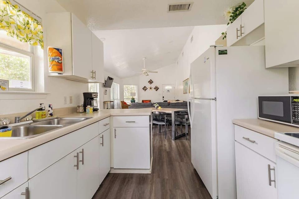 Fully equipped kitchen with full size appliances, generous counter space, and dining area for group meals. Cook breakfast before a river float or host a Spring Break dinner near Schlitterbahn, Gruene, and downtown attractions.