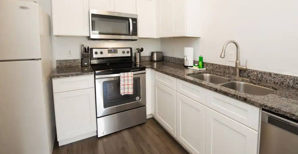 Fully equipped kitchen and dining area with all essentials for seamless meals and gatherings.