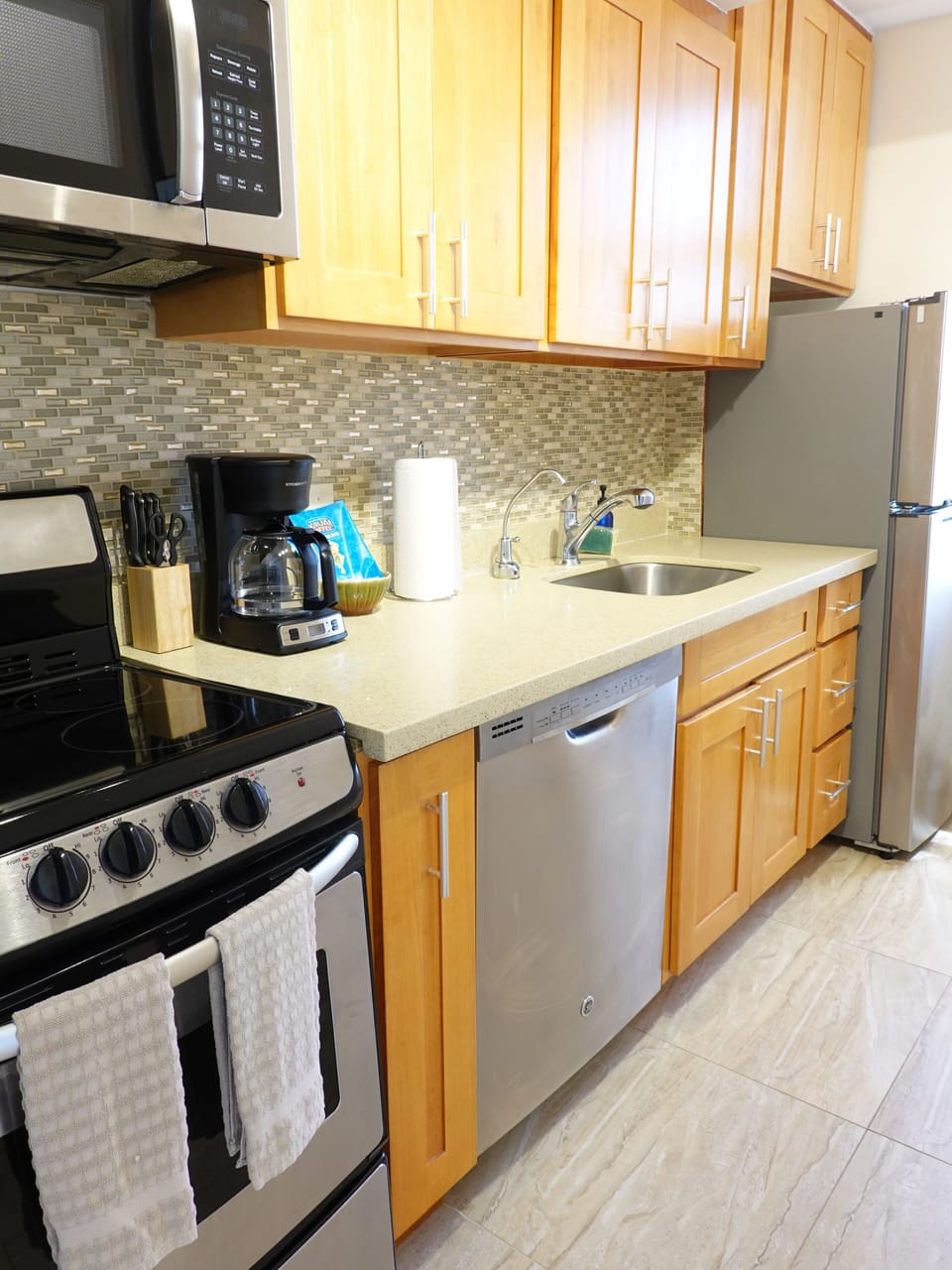 Galley kitchen with dishwasher to make life easy while on vacation.