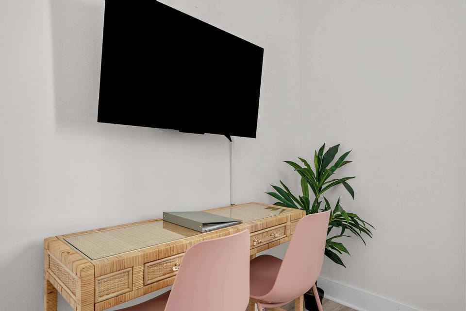 Stay productive while away—this dedicated workspace is perfect for catching up on work or planning your next adventure. - The Pinkshell - Panama City, FL