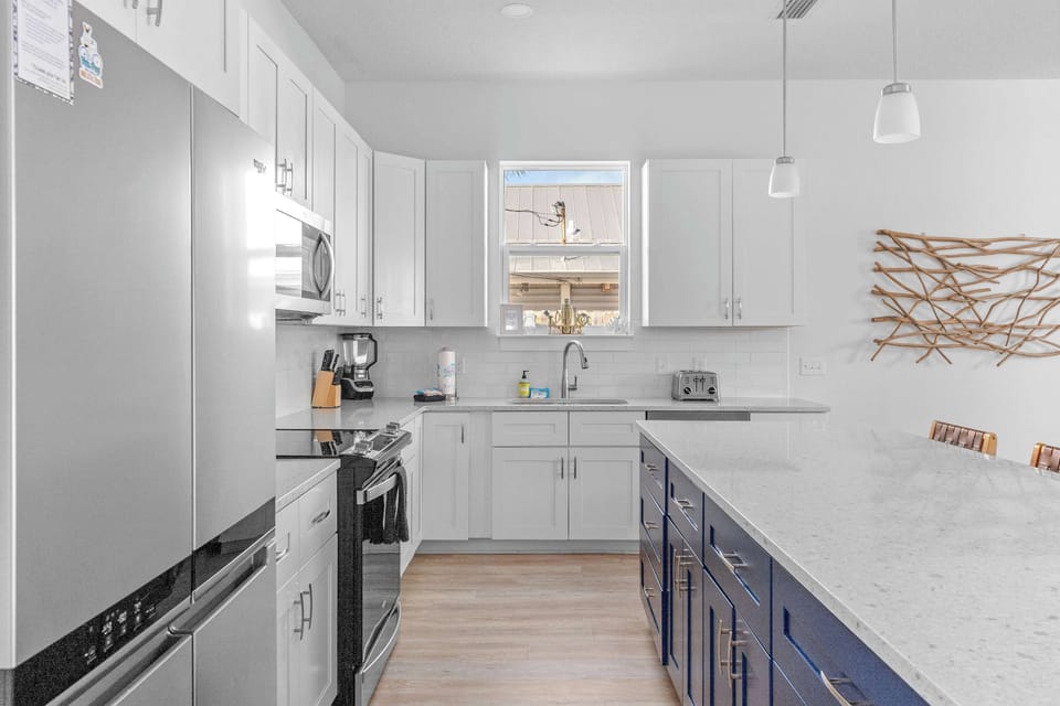 Modern stainless steel appliances make cooking a breeze on vacation. - The Pinkshell - Panama City, FL