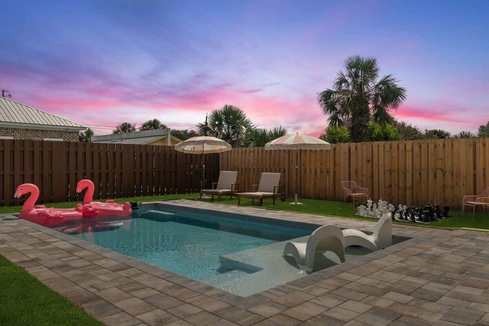 Lounge poolside with a drink in hand—your ultimate relaxation spot awaits. - The Pinkshell - Panama City, FL