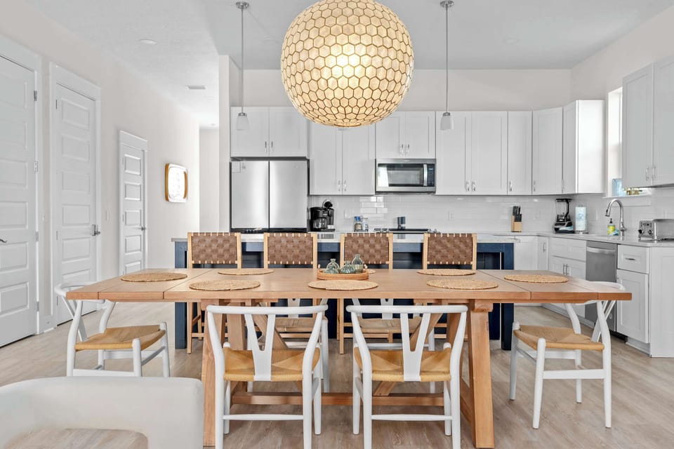 Gather around the dining table and create unforgettable mealtime memories. - The Pinkshell - Panama City, FL