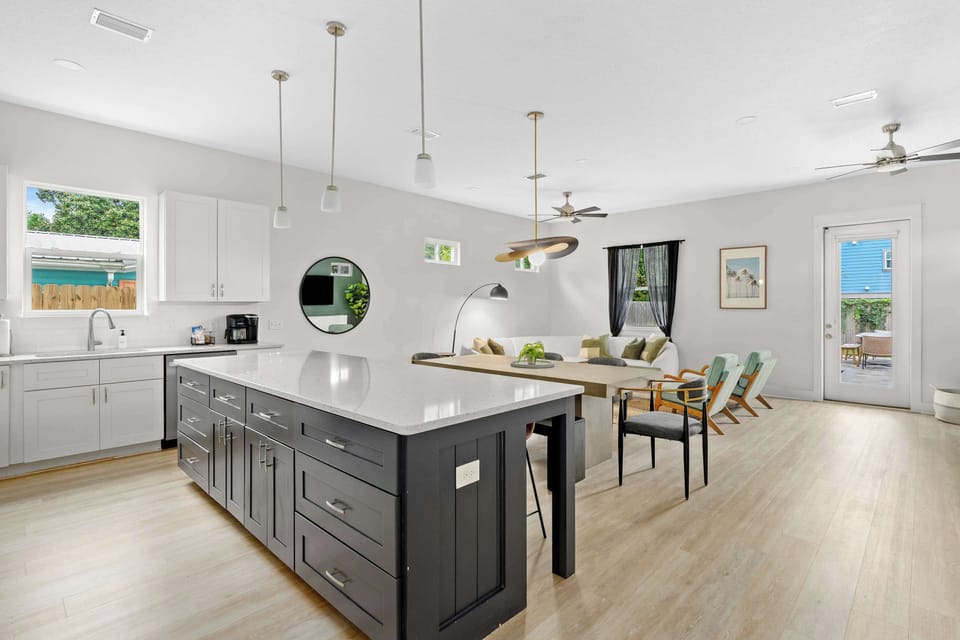 Fully equipped kitchen with high-end stainless steel appliances, ample counter space, and a breakfast bar—ideal for preparing delicious meals. - The Sandbar - Panama City Beach, FL