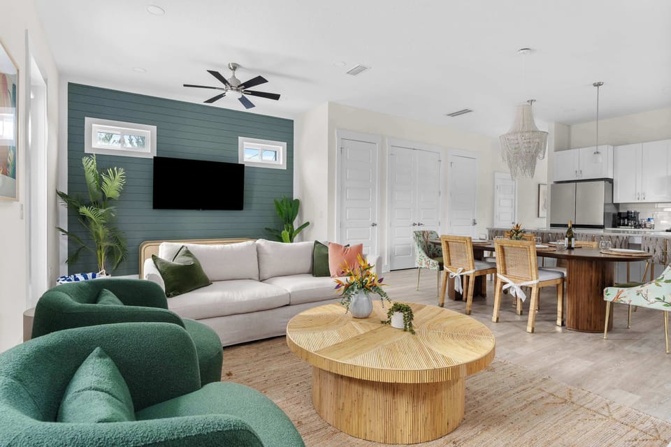 Kick back and relax in the open-concept living room with plush seating and stunning decor. - The Seafoam - Panama City Beach, FL